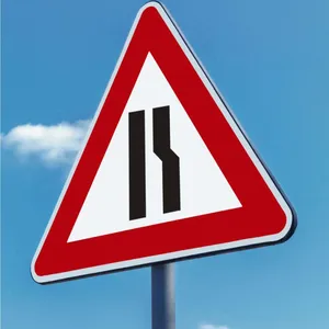 Road Narrows On The Right Ahead