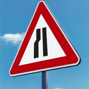 Road Narrows on The Left Ahead